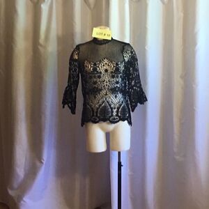 NWOT medium size crocheted black top with back gold statement zipper